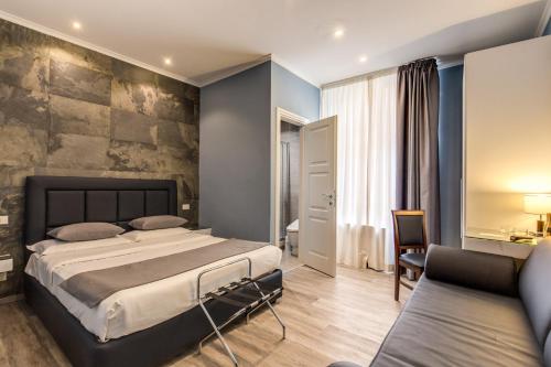 Katil atau katil-katil dalam bilik di Residenza Belli Inn