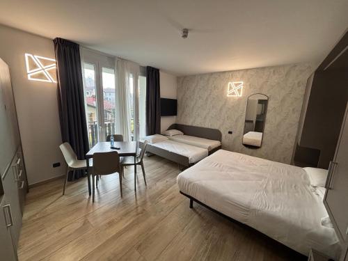 Postel nebo postele na pokoji v ubytování Bis Hotel Varese