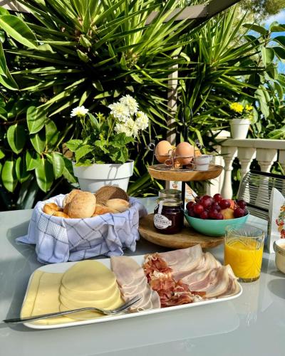 a table with a plate of food on a table at Villa Mariposa in Casas Albardanera