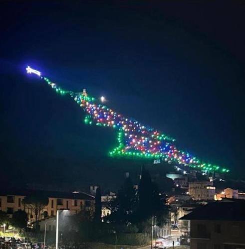 a long line of lights in the sky at night at A casa di Michela in Gubbio