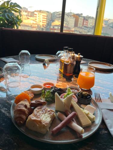 a plate of food on top of a table at Novotel Istanbul Bomonti in Istanbul