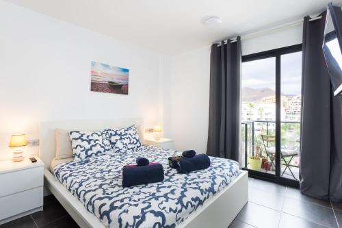 Ένα ή περισσότερα κρεβάτια σε δωμάτιο στο New apartment center Los Cristianos