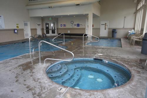 a pool in a gym with a swimming pool at Homestead Resort in Lynden