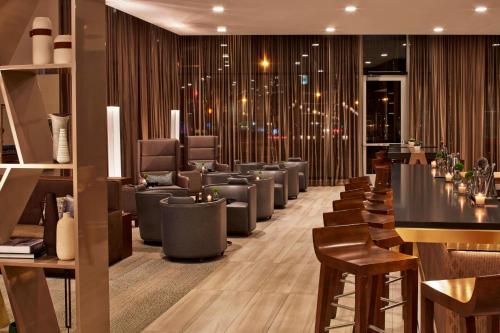a salon with a row of chairs and a barber shop at AC Hotel by Marriott Minneapolis Downtown in Minneapolis