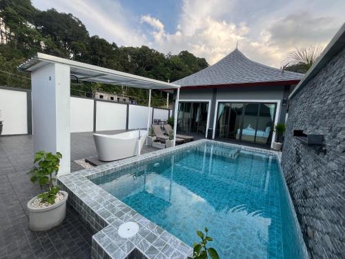 a swimming pool in the middle of a house at The M Millions Pool Villa, Aonang Krabi -Free Shuttle to Aonang Beach in Ao Nang Beach