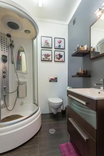 a bathroom with a shower and a toilet and a sink at Spacious Family Oasis in Tavira by Lisbeyond in Tavira