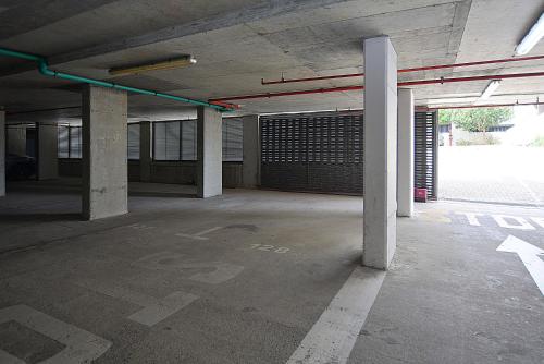 an empty parking lot with pillars in a parking garage at Azure Bliss in Big Bay
