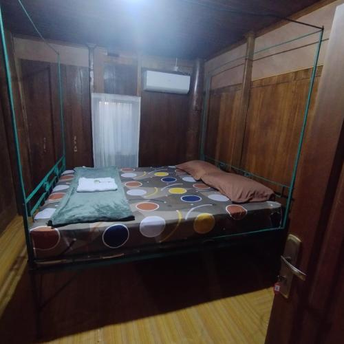 a small bed in the back of a boat at Homestay Aceh House in Banda Aceh