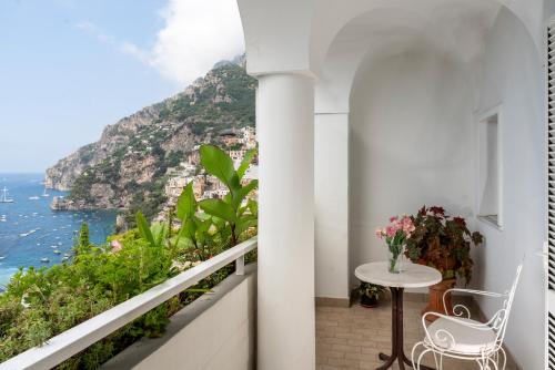 a balcony with a view of the amalfi coast at Hotel Eden Roc in Positano