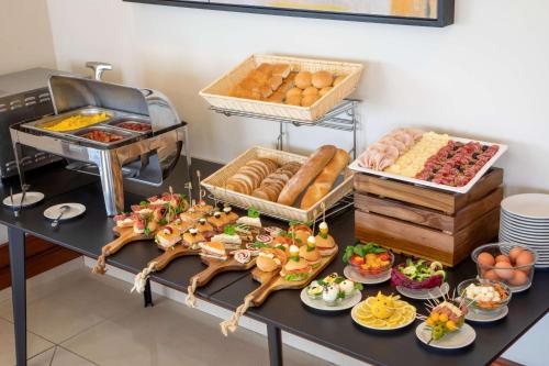 a buffet with bread and other food on a table at Best Western Hotel Viterbo in Viterbo
