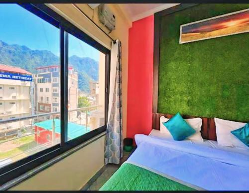 Cama ou camas em um quarto em The Rivanta Tapovan