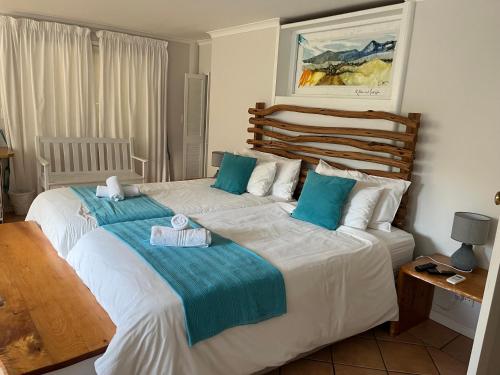 Ένα ή περισσότερα κρεβάτια σε δωμάτιο στο Brenton Beach House