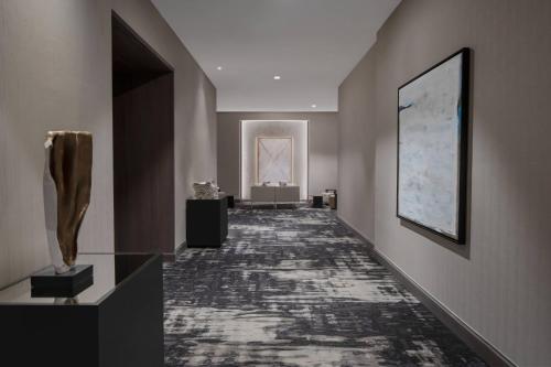 a hallway of a building with a painting on the wall at AC Hotel by Marriott Orlando Downtown in Orlando