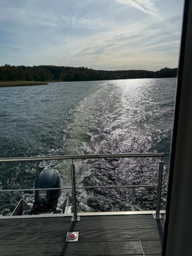 a view from the back of a boat on the water at Seahome Pape in Flessenow