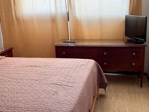TV a/nebo společenská místnost v ubytování Atlántico Peatonal 2