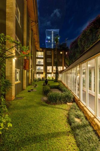 a courtyard of a building at night with lights at Best Western Nairobi Upper Hill in Nairobi