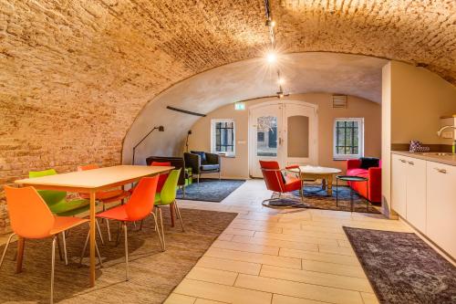 a room with a table and chairs in a building at Beautiful canal apartment in Utrecht for 4 persons in Utrecht