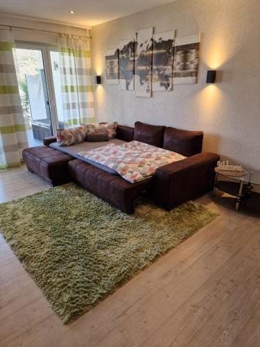 a living room with a couch and a rug at Ferienwohnungen Krause in Cochem