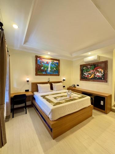 a bedroom with a large bed in a room at Danasari Homestay in Ubud