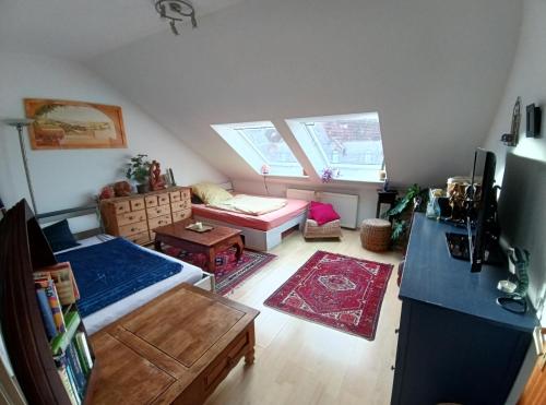 a small room with a bed and a couch at Welcome Home in Bochum
