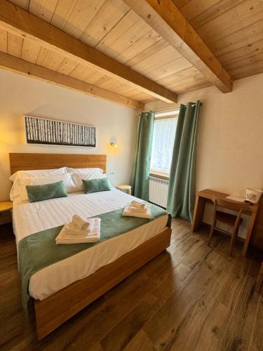 Postel nebo postele na pokoji v ubytování Rifugio San Carlo