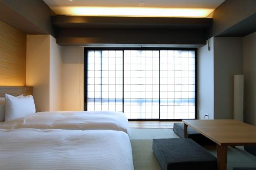 KOKO HOTEL Residence 京都 二条城にあるベッド