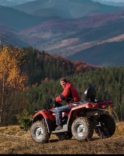 a man riding on the back of a four wheeler at Basqal Resort & SPA in Basqal