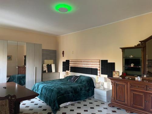 a bedroom with a bed and a table and a mirror at P&P nella natura in Cassino