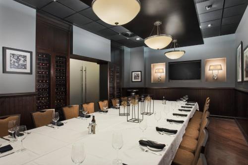 a conference room with a long table and chairs at Hotel Duval, Autograph Collection in Tallahassee