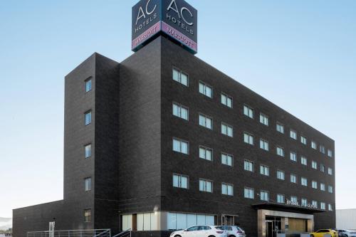 a building with a sign on the top of it at AC Hotel Gijón by Marriott in Gijón