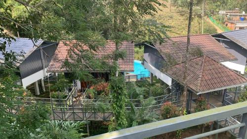 an aerial view of a house with roofs at B'camp Resorts & Homestays in Wayanad