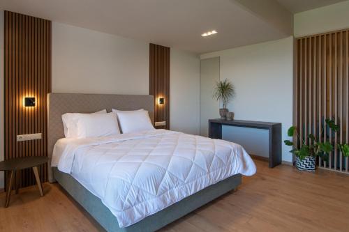 Postel nebo postele na pokoji v ubytování KOSMAPOLITAN hotel