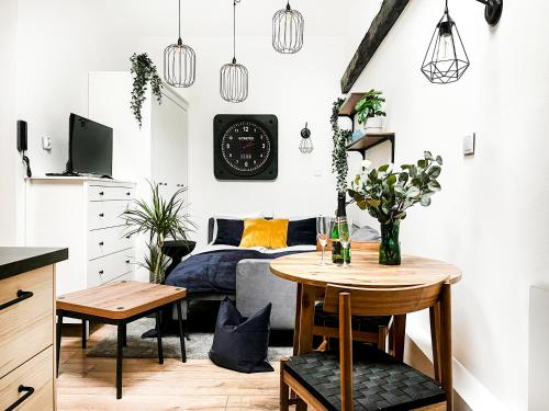 a living room with a bed and a table at Apartment Premium Jacuzzi, Old Town Cracow in Kraków