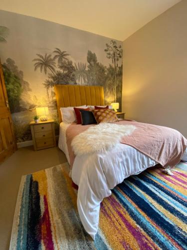 a bedroom with a large bed and a rug at Newly Designed Home from Home in Retford in Retford