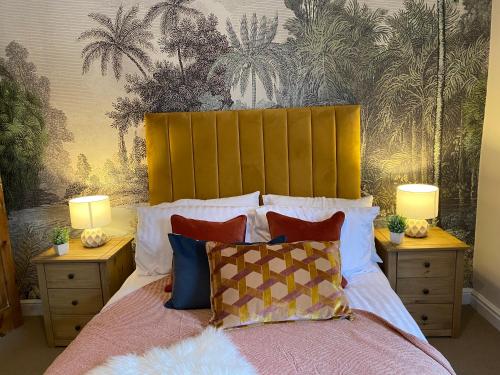 a bedroom with a large bed with two night stands at Newly Designed Home from Home in Retford in Retford