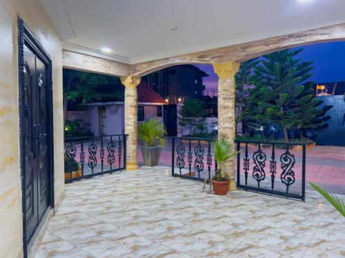 an entrance to a house with an iron gate at Branch-Lina in Amasaman