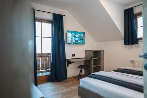 Katil atau katil-katil dalam bilik di Chalets und Apartments Hauserhof Nassfeld