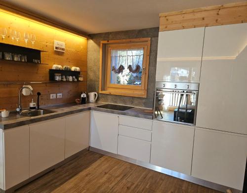 Kuchyň nebo kuchyňský kout v ubytování Dany Lodge Livigno