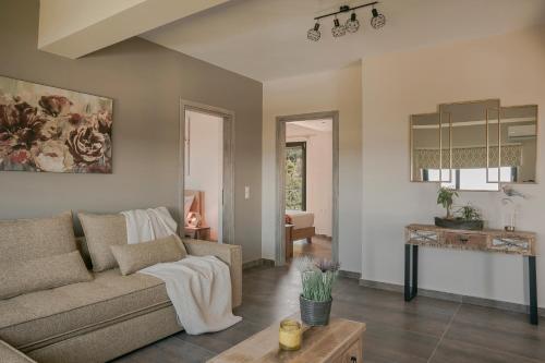 a living room with a couch and a table at Queen Bee Residence in Minia