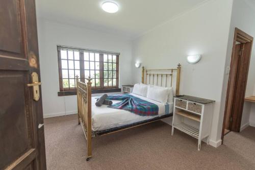 Una cama o camas en una habitación de Verdi Luxury Cottage 4