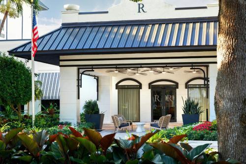 a building with two chairs and an american flag at Renaissance Boca Raton Hotel in Boca Raton