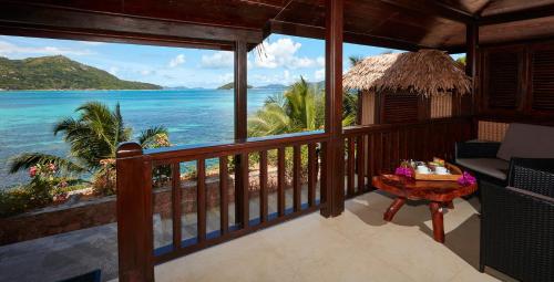 a view of the ocean from a resort balcony at Colibri Hotel in Baie Sainte Anne
