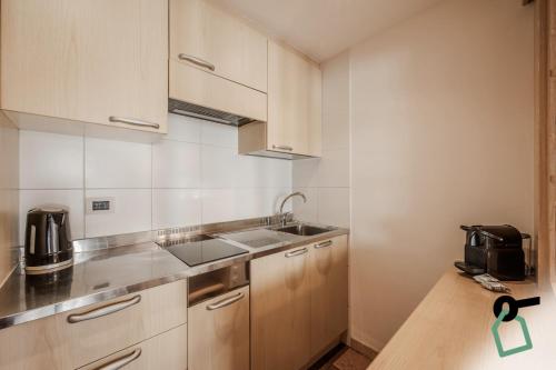 Η κουζίνα ή μικρή κουζίνα στο HOTIDAY Apartment Collection - Santa Cristina