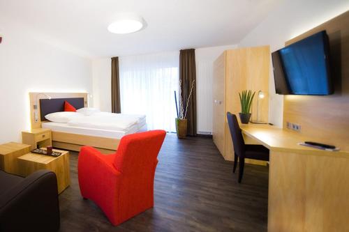 TV a/nebo společenská místnost v ubytování Boardinghouse Rülzheim