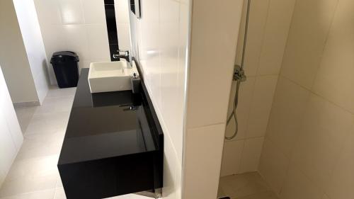 a bathroom with a sink and a shower at Casa Vista Mar in Río San Juan