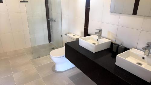 a bathroom with a toilet and a sink at Casa Vista Mar in Río San Juan