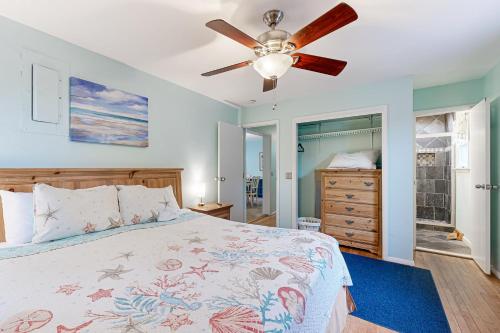 a bedroom with a bed and a ceiling fan at Teal Haven in Ocean Pines