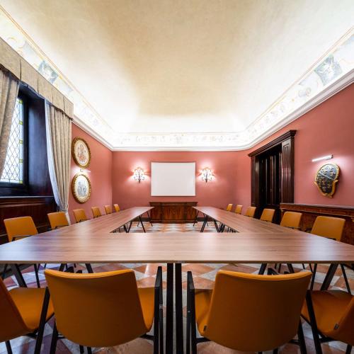 a conference room with a large table and chairs at Tivoli Palazzo Gaddi Firenze Hotel in Florence
