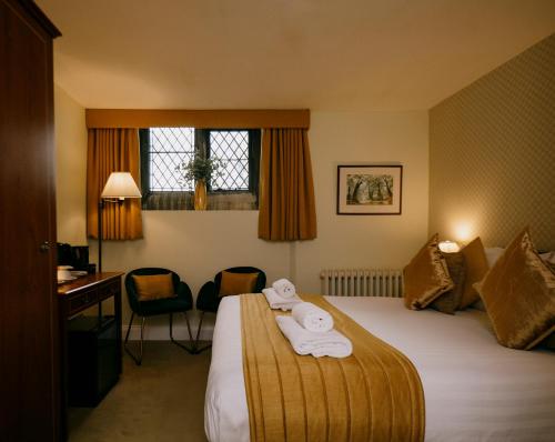 Letto o letti in una camera di The Old Palace Lodge