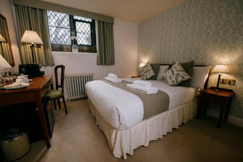Letto o letti in una camera di The Old Palace Lodge